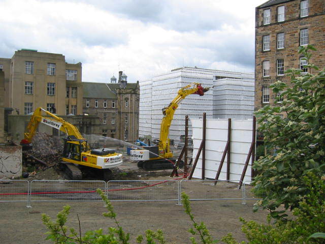 The demolition of the old RIE, showing Lister's Lauriston Terrace flats on the right.